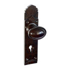 6843MOT<br />Walnut Brown Bakelite stepped oval door knobs on deco back plates with keyhole